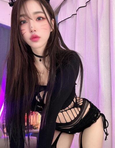 Miokawa smiling playfully in a casual yet sexy outfit, showing her fun side